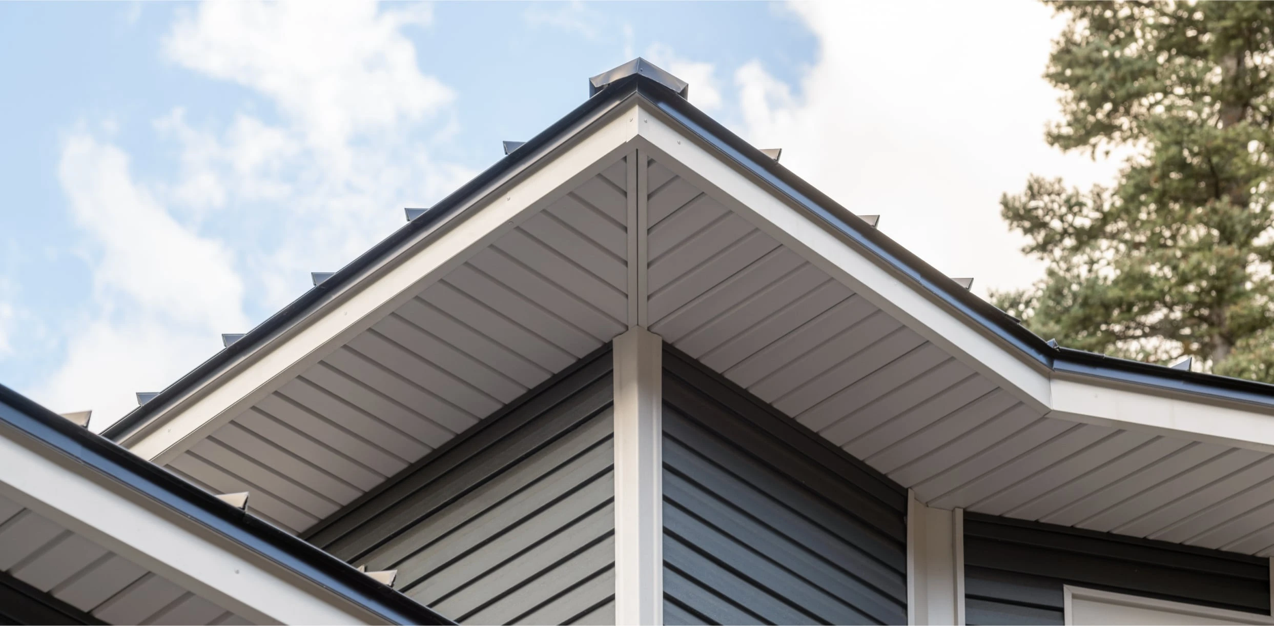 Close-up of white vented soffit installed by Tri-Link